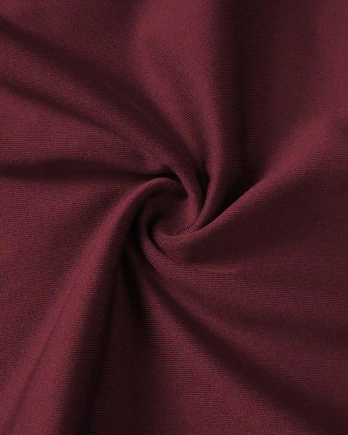 Close-up of supportive slim-fitting maternity joggers in a rich burgundy, showing soft, stretchy fabric.