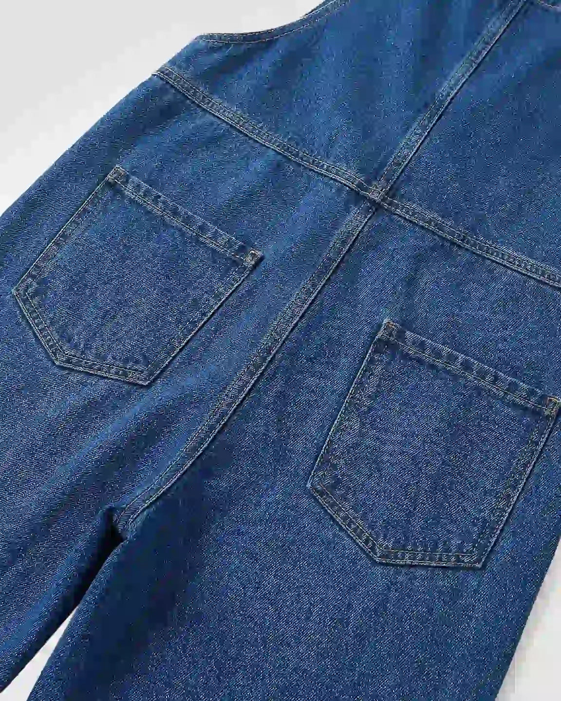 Blue denim maternity jumpsuit with adjustable straps and two back pockets.