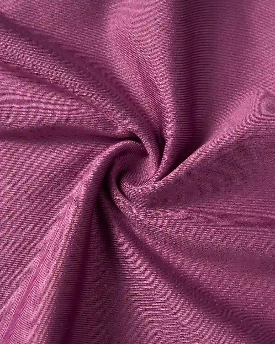 Close-up of supportive slim-fitting maternity joggers in a soft, stretchy, deep plum fabric with gentle folds.