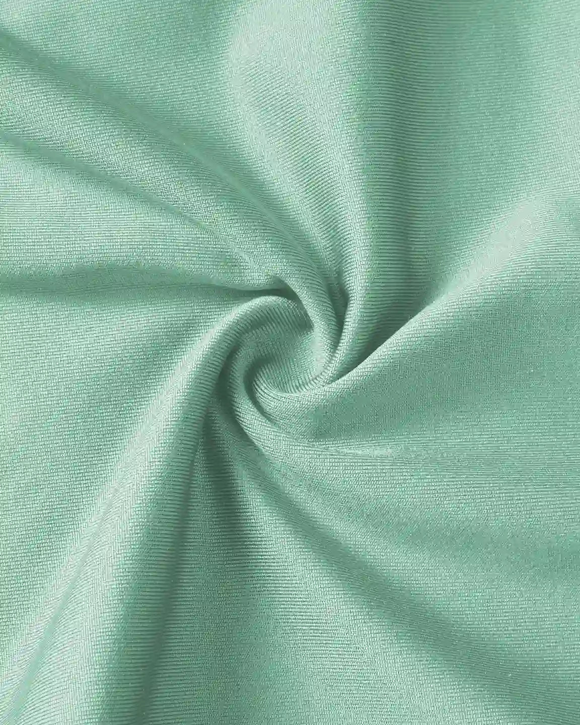 Close-up of soft, stretchy mint green fabric, ideal for supportive maternity joggers.