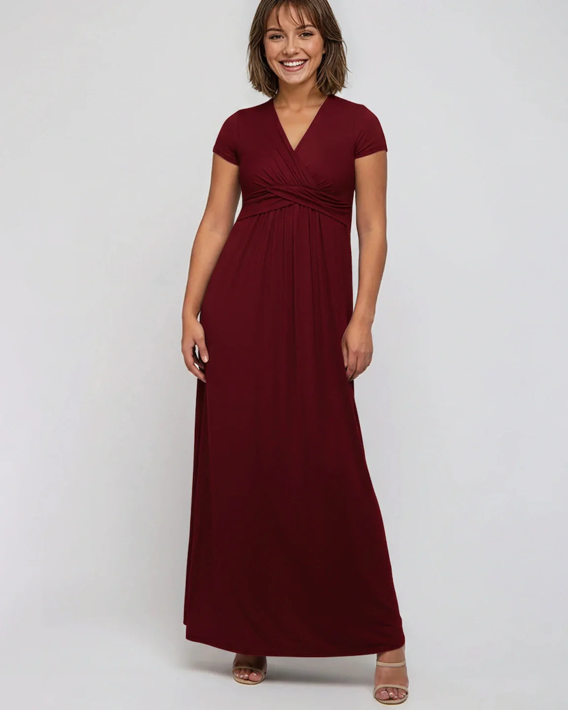 Smiling woman in a burgundy Twist Front Draped Maternity Nursing Maxi Dress with short sleeves.