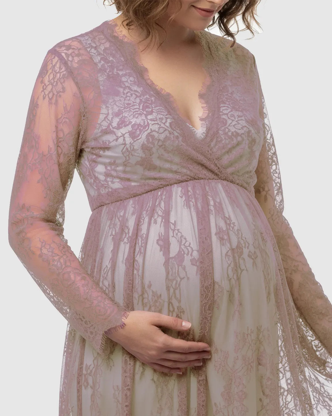 Maternity maxi dress in sheer floral lace, light purple, with an empire waist and long sleeves.