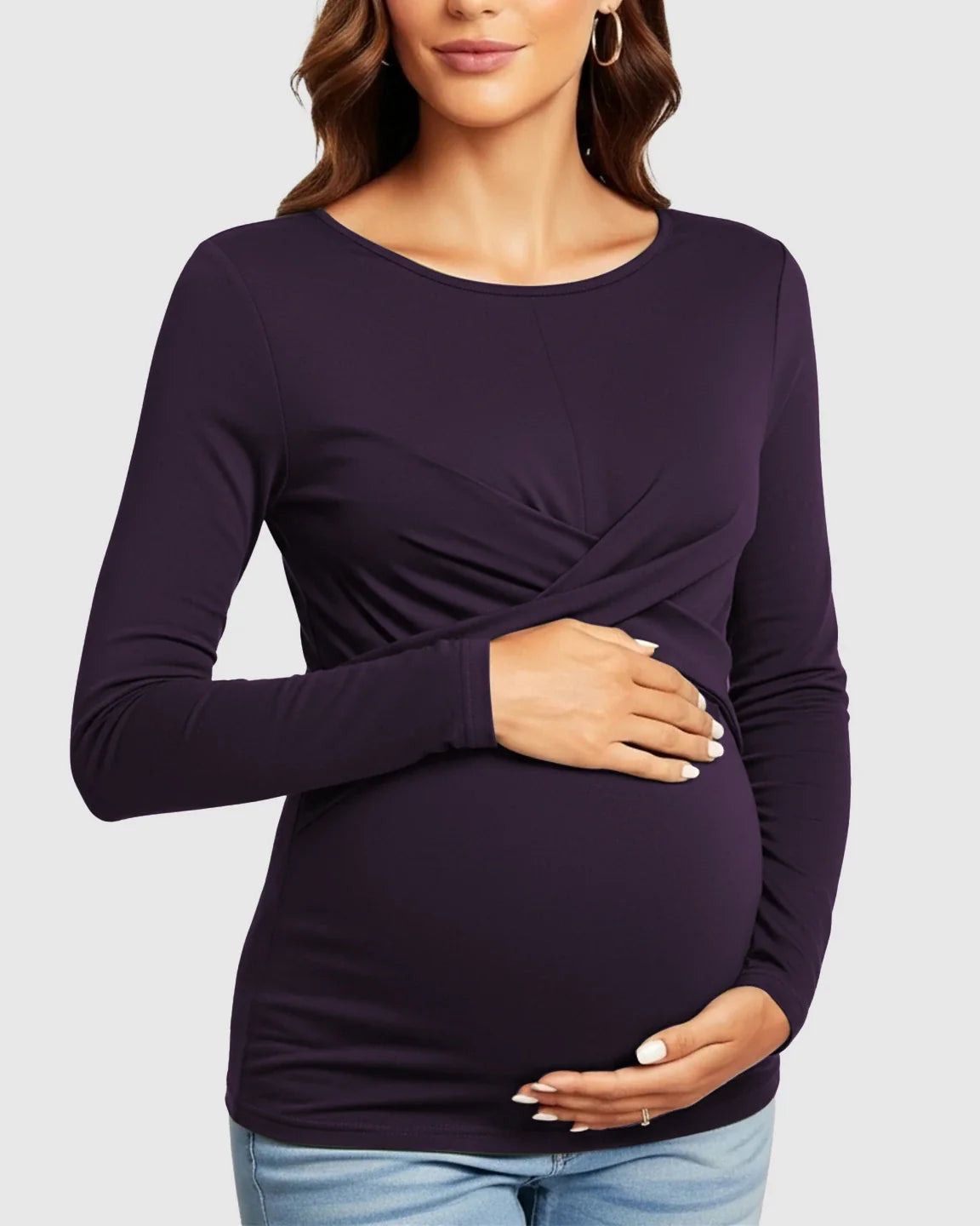 Maternity top in deep purple with cross-pleat twist-front detail, long sleeves, and round neckline.