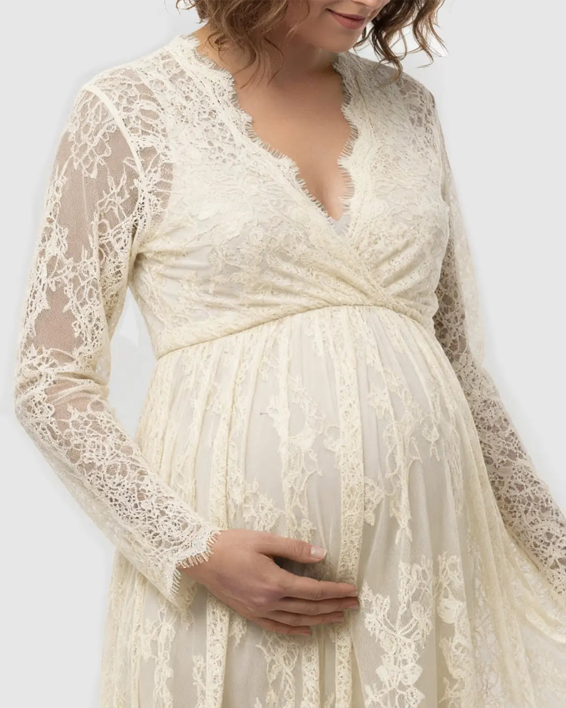 Cream sheer floral lace empire waist maternity maxi dress with long sleeves.
