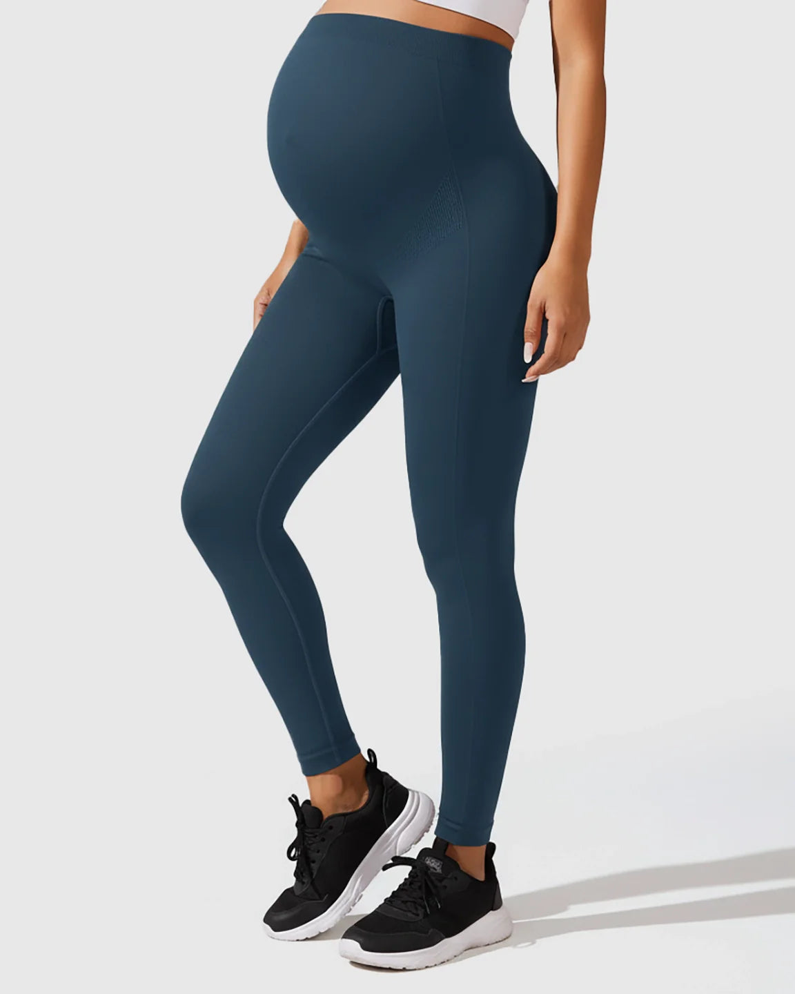 Seamless M-shape maternity leggings in deep teal, featuring a high-waisted, full-belly support design.