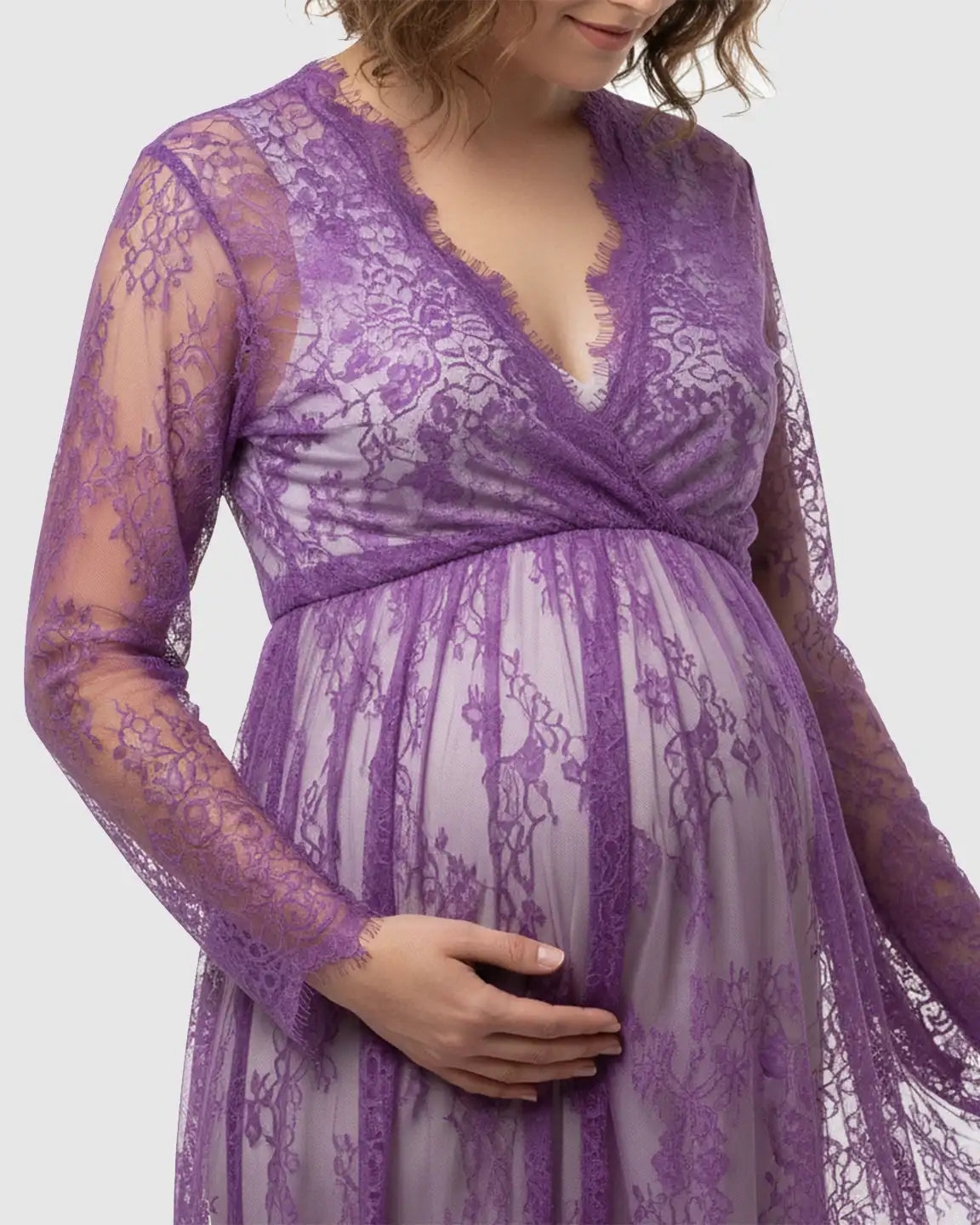 Purple sheer floral lace empire waist maternity maxi dress with long sleeves.