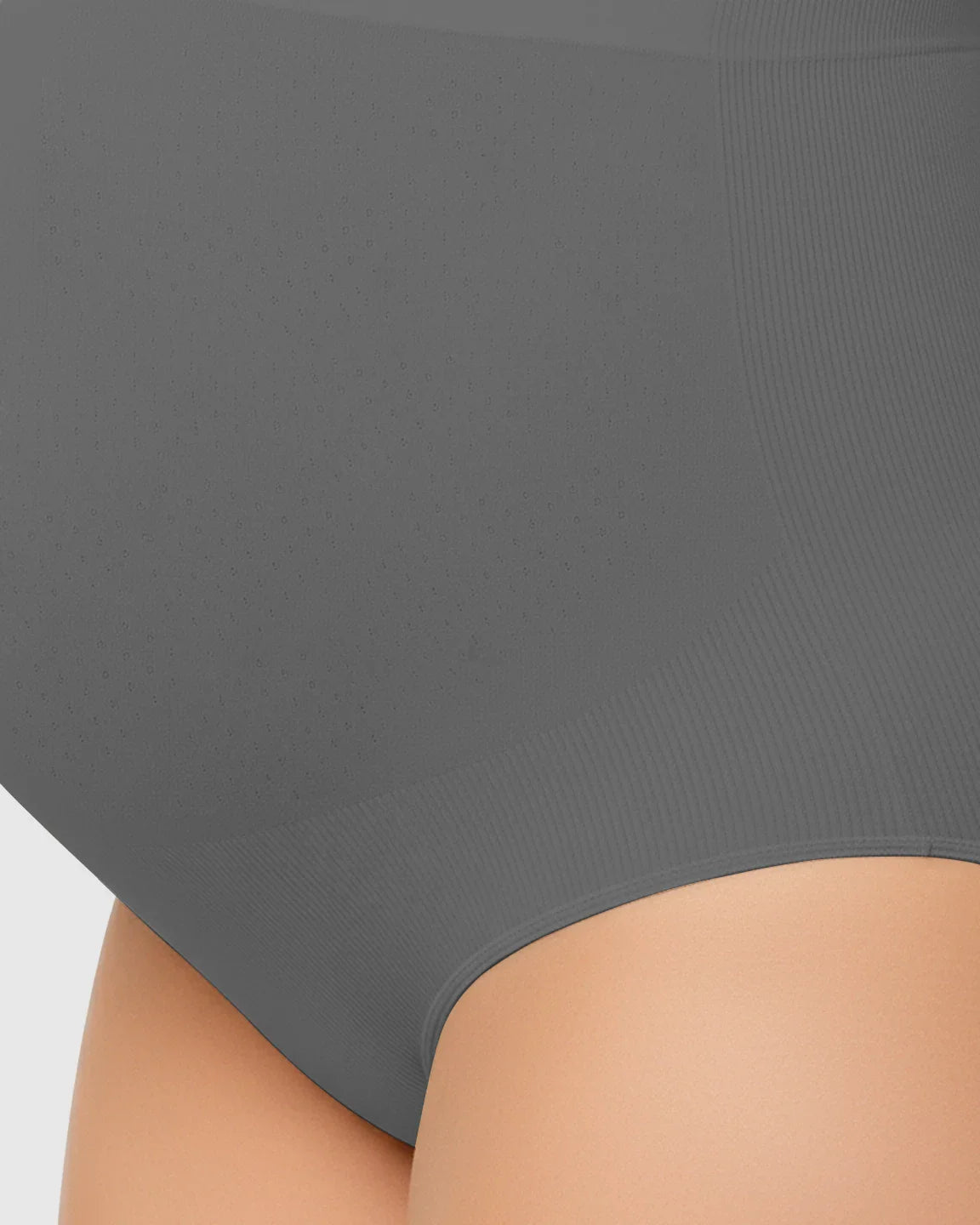 Gray seamless high-waist maternity underwear with belly support, shown on a model's hip.