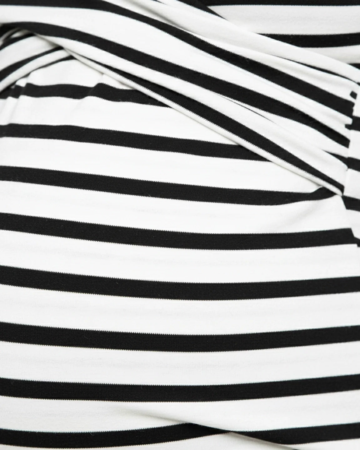 Close-up of a black and white striped maternity long-sleeve V-neck shirt with a cross-wrap front.