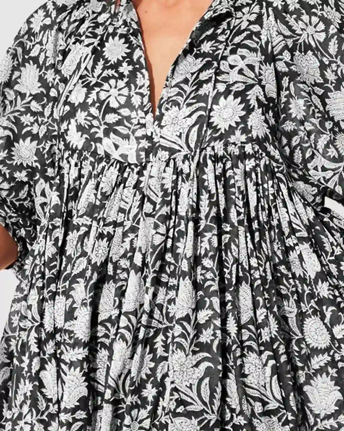 Black and white floral loose-fit maternity midi dress with gathered shoulders and puff sleeves.