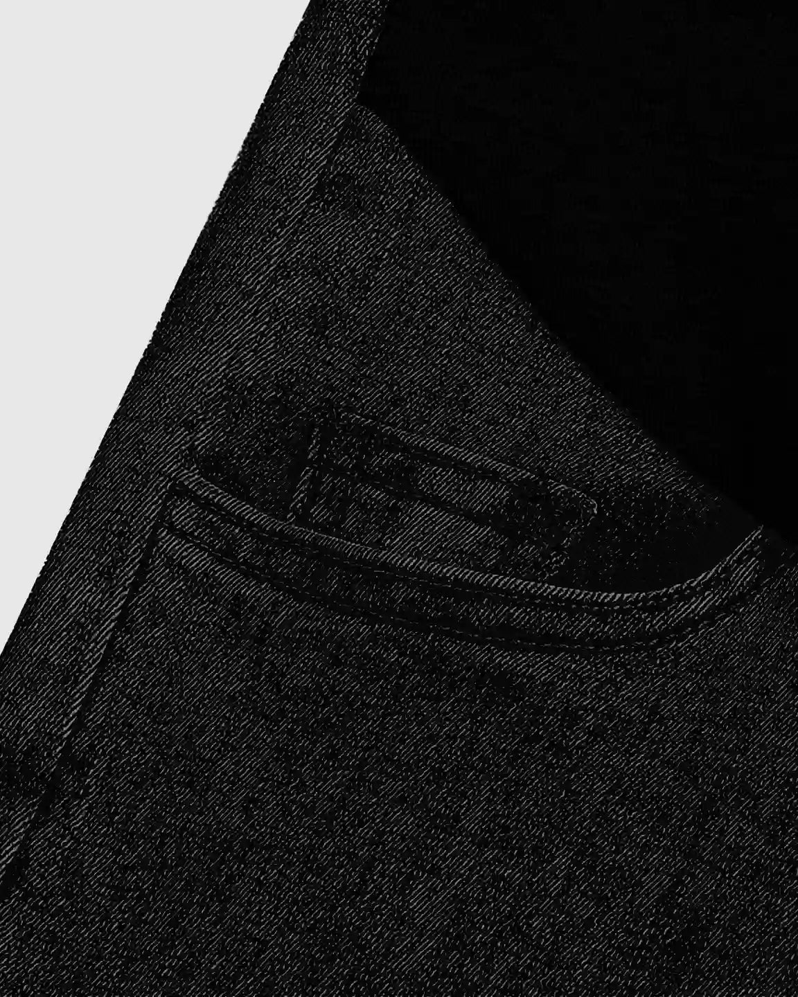Close-up of black stretch denim straight-leg maternity jeans with a front pocket and belt loop.