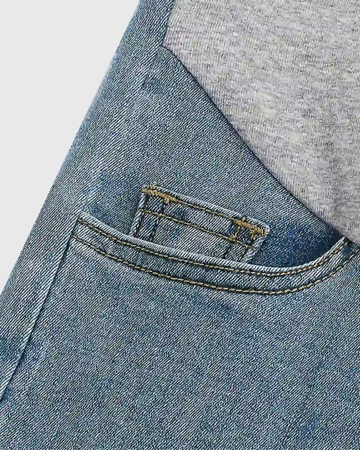 Light wash stretch denim maternity jeans with grey over-the-belly panel and front pocket detail.
