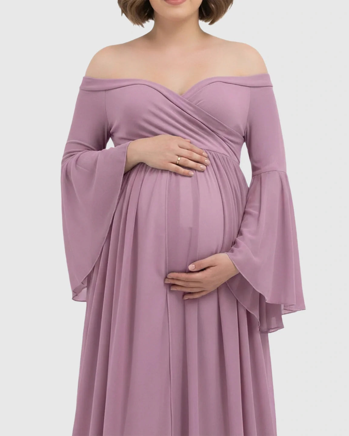 Maternity photoshoot gown in soft lavender chiffon with off-shoulder neckline, bell sleeves, and flowing skirt.