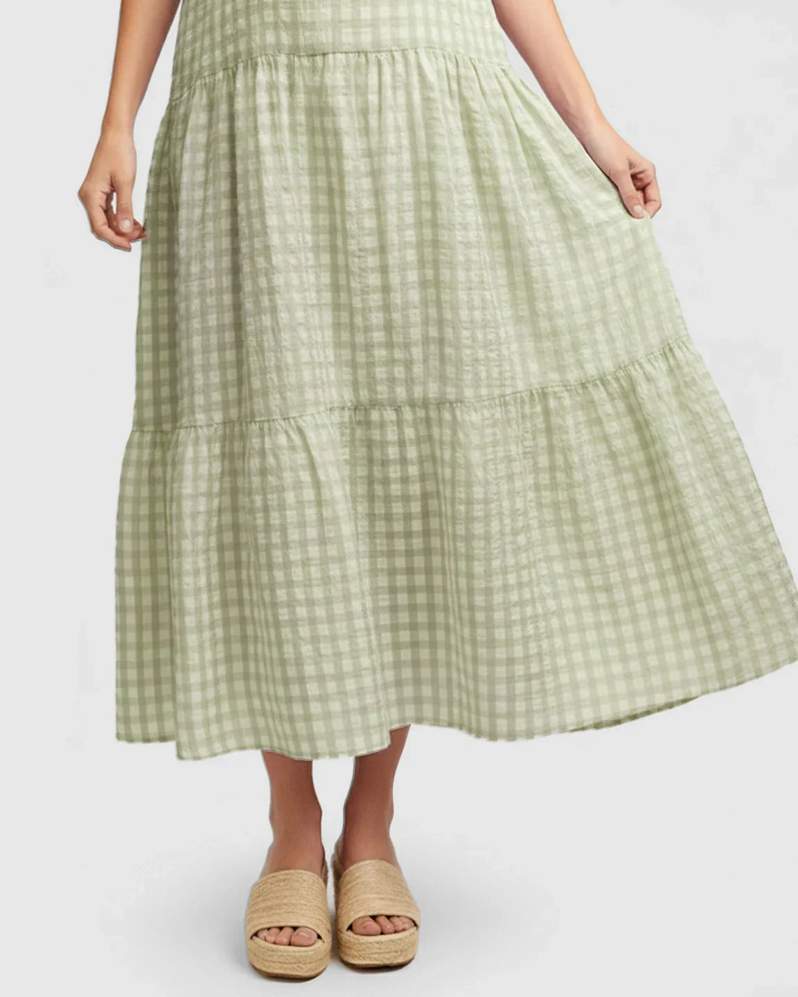 Light green checkered maternity maxi dress with tiered skirt, made of lightweight cotton.