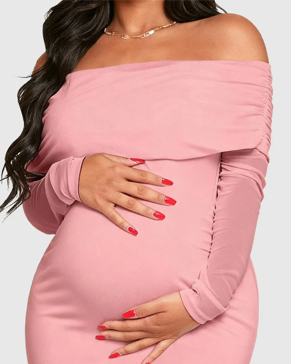 Pink off-shoulder draped neck mermaid fit maternity maxi dress, hugging a pregnant belly.