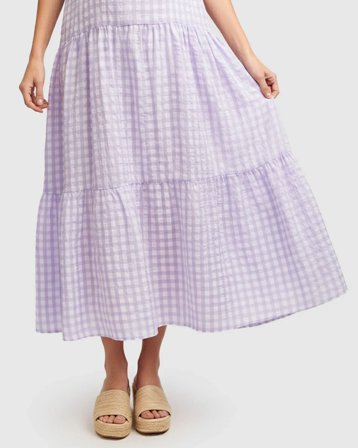 Lavender checkered maternity maxi dress with puffed sleeves and tiered skirt, worn with espadrille sandals.