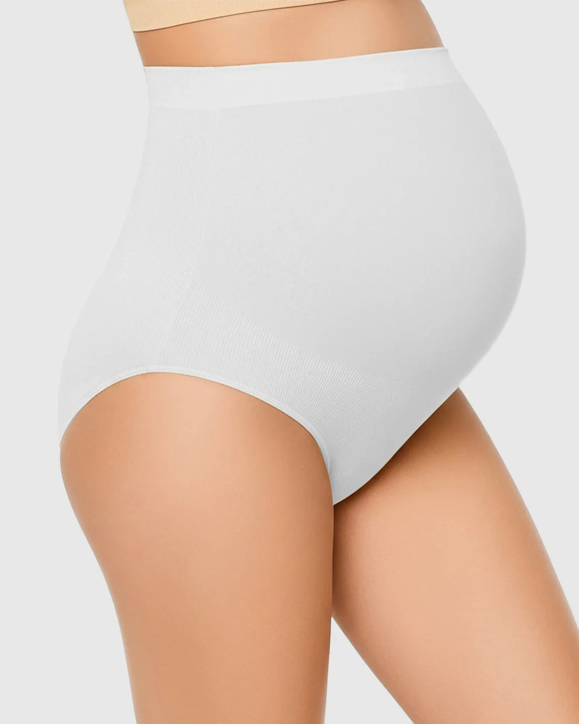 White high-waist seamless maternity underwear on a pregnant model, offering gentle belly support.