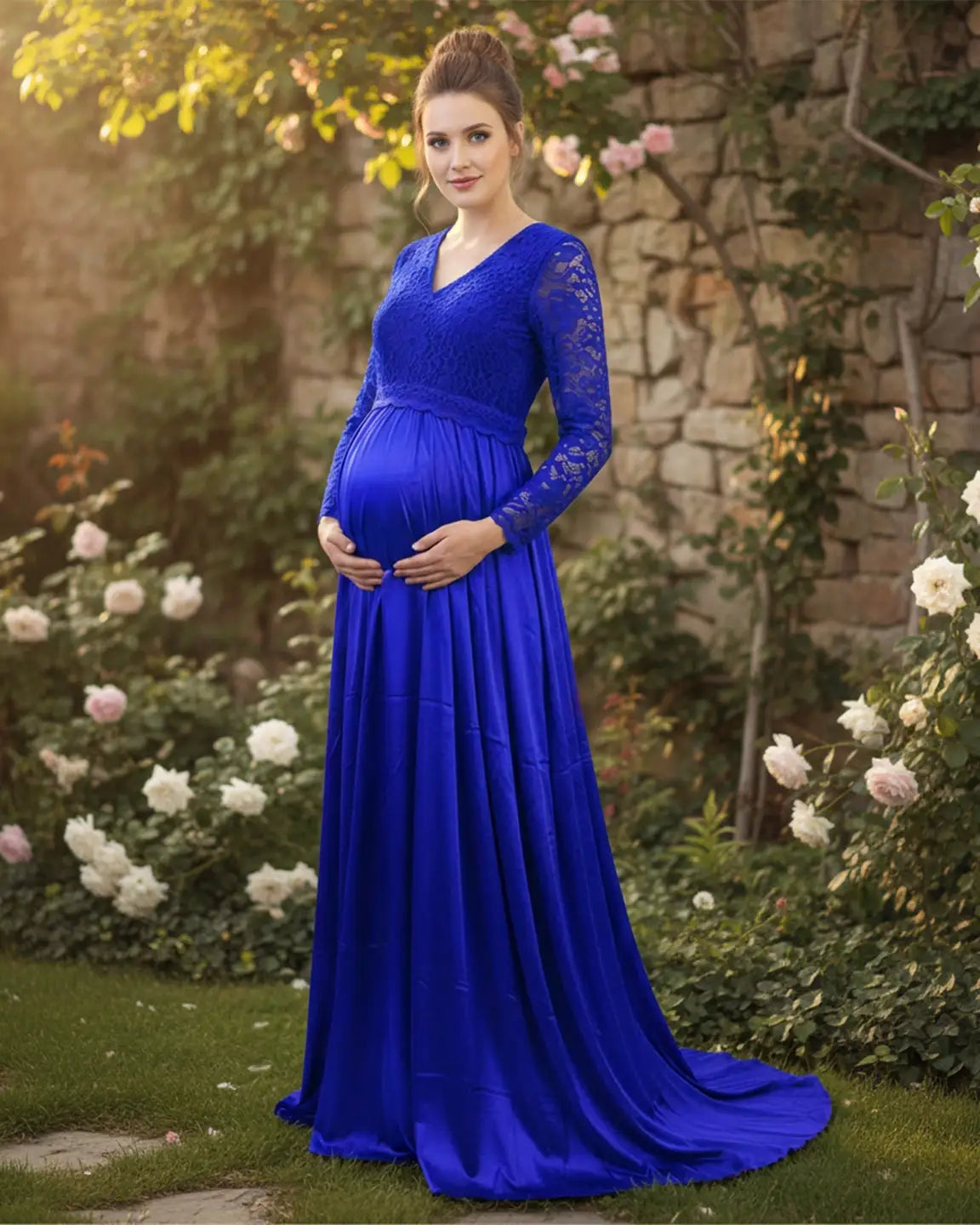 Royal blue lace-spliced bodice maternity maxi dress with trailing skirt, worn by a pregnant woman.