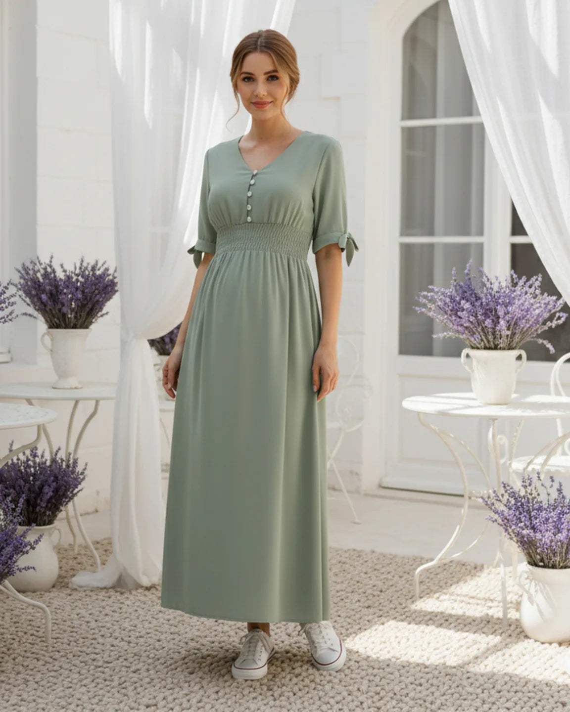 Mint green V-neck empire waist maternity maxi dress with buttons, short sleeves, and smocked waist.