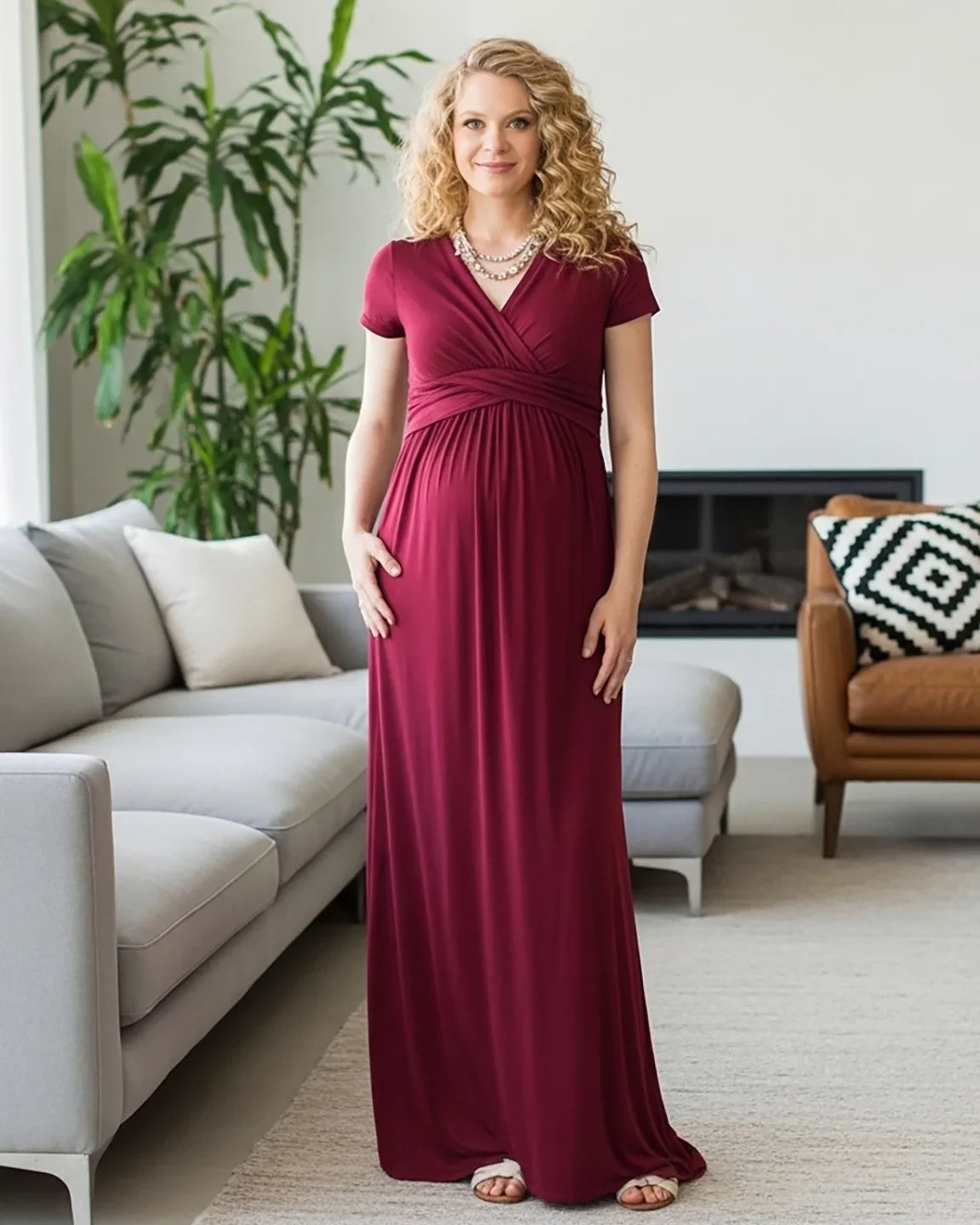 Woman in a burgundy Twist Front Draped Maternity Nursing Maxi Dress with short sleeves and a V-neck.