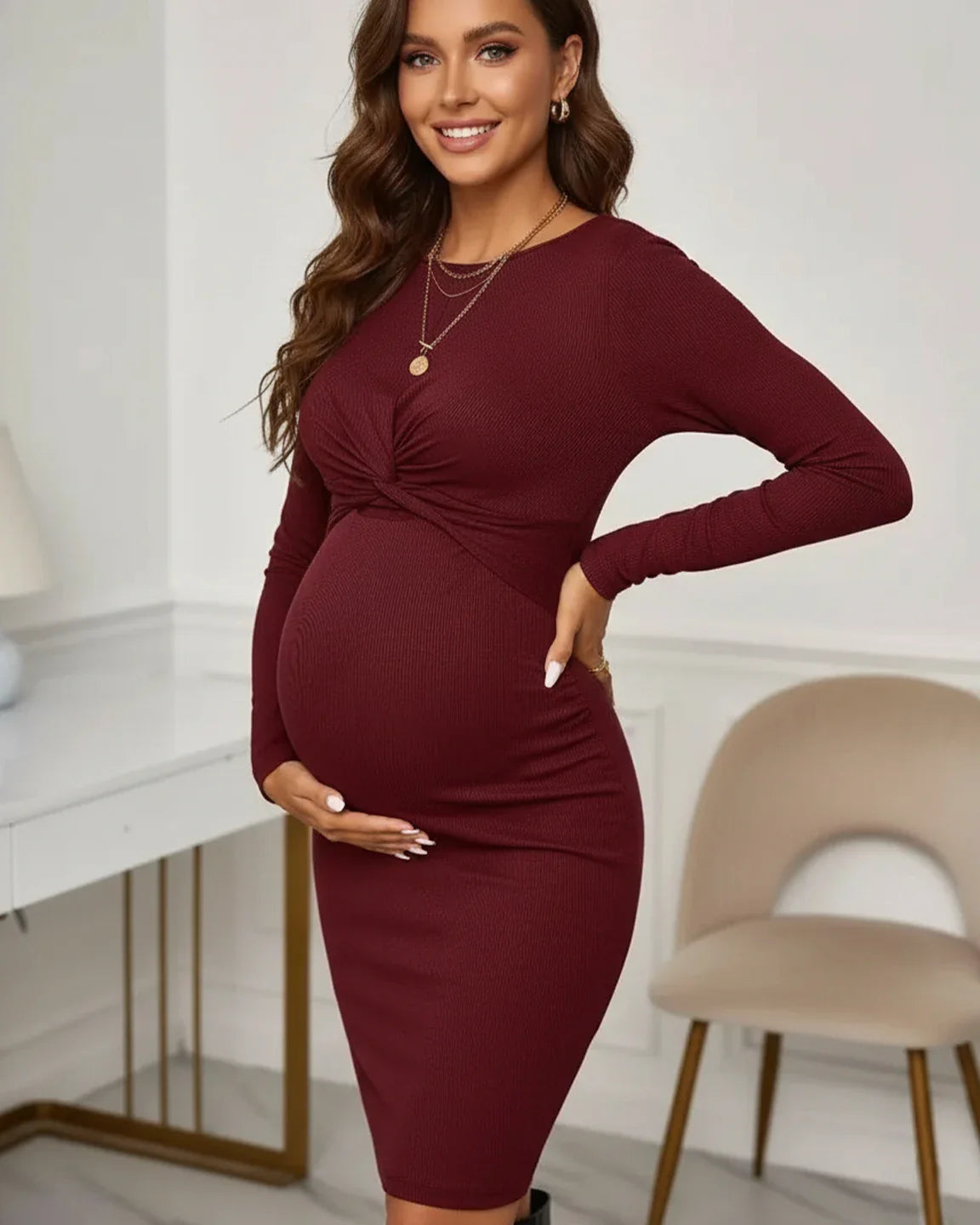 Smiling pregnant woman in a burgundy ribbed knit twist-front bodycon maternity dress, highlighting her bump.