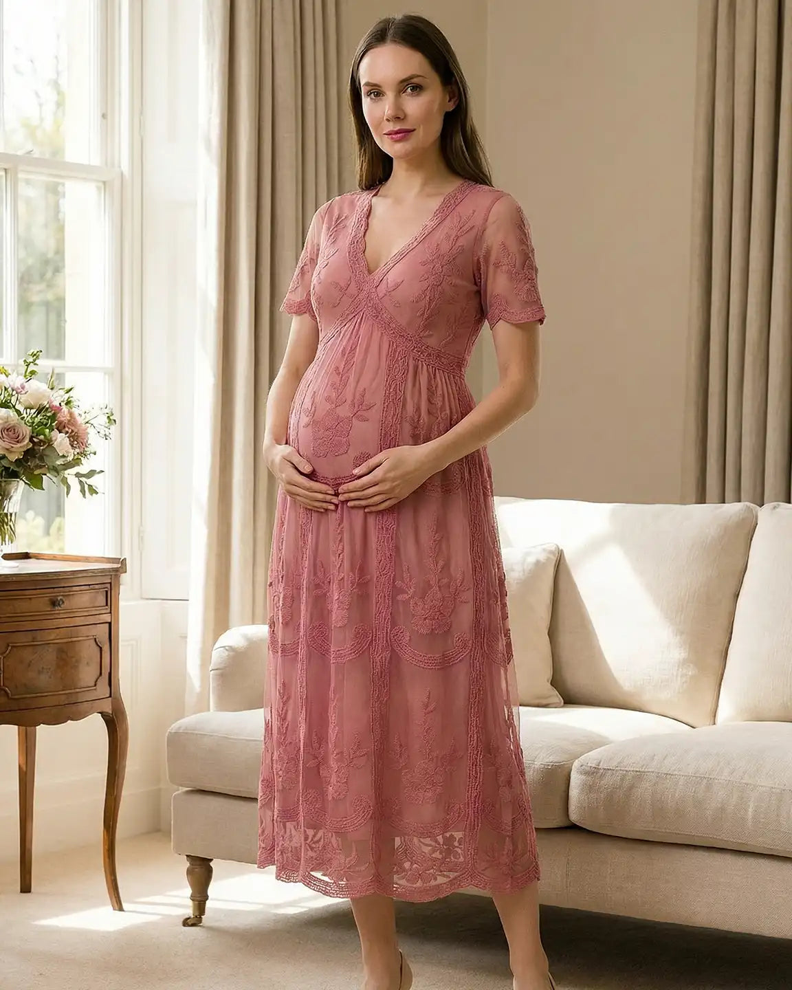 Maternity midi dress in dusty rose lace with V-neck, three-quarter sleeves, and a soft swing skirt.