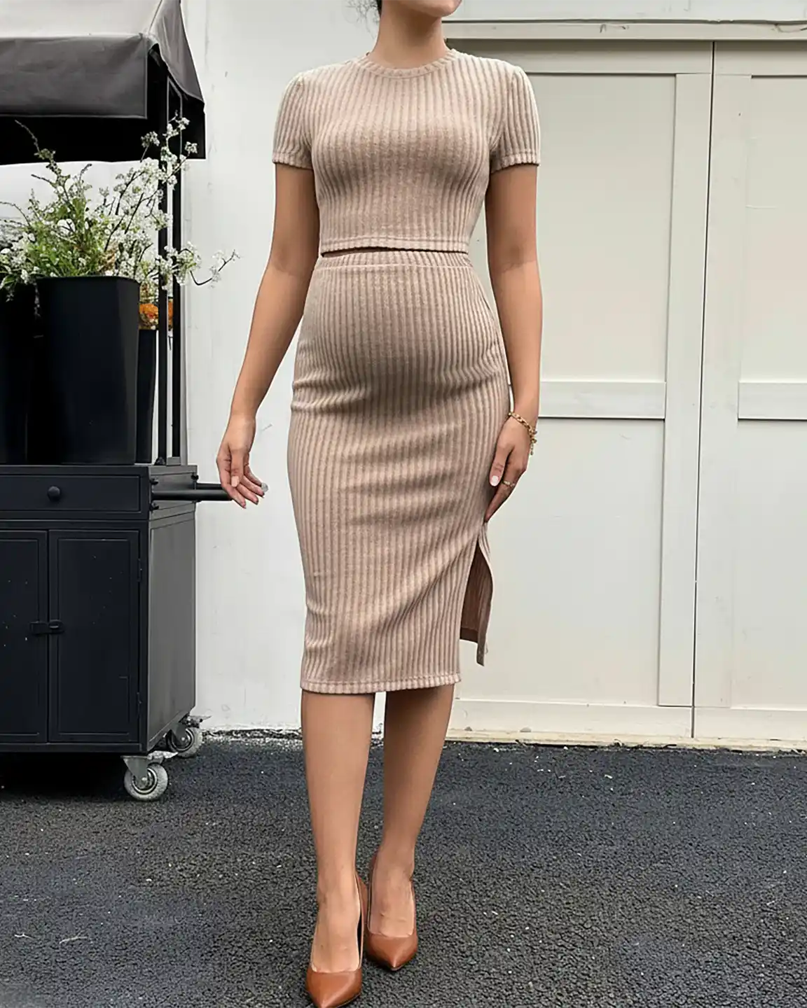 Maternity ribbed crop top and side-slit bodycon midi skirt set in a neutral beige color.