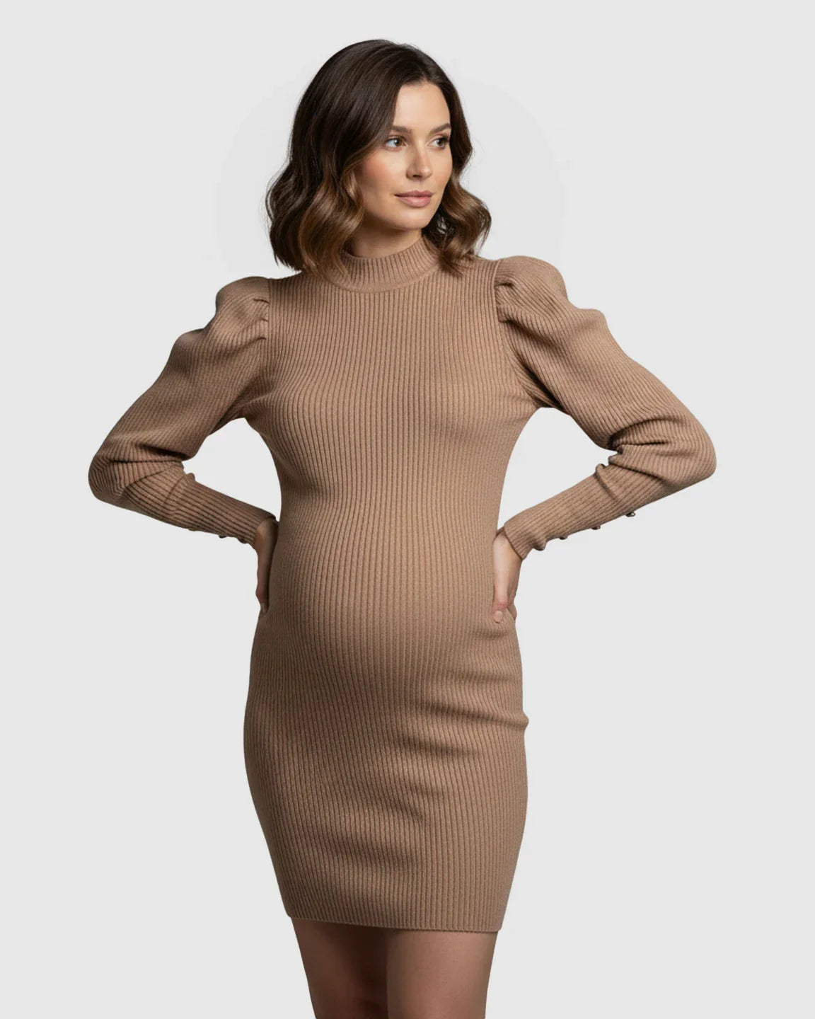 Maternity ribbed knit bodycon dress in tan with puff sleeves, mock neck, and button cuffs.