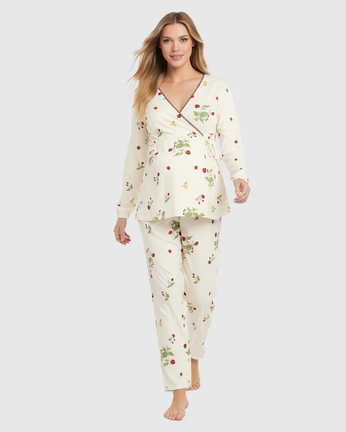 Blonde model in a cream floral wrap kimono style maternity pajama set with red strawberries.