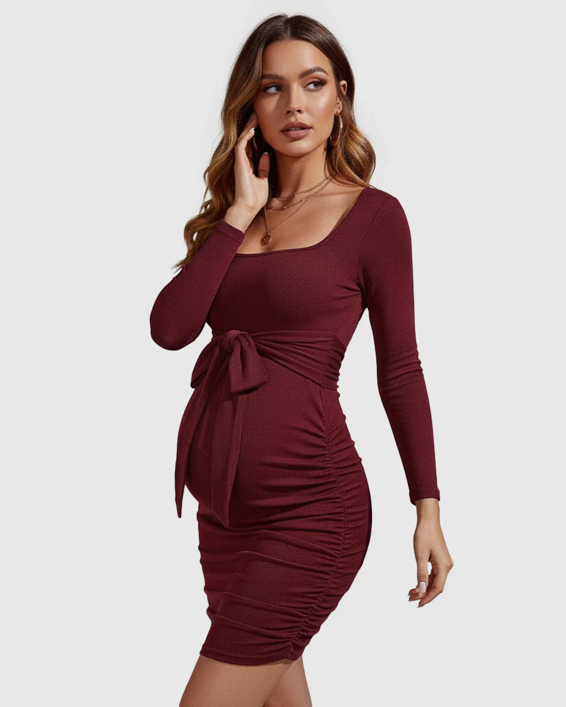 Burgundy ribbed long-sleeve maternity mini dress with square neckline, tie-waist, and side ruching.