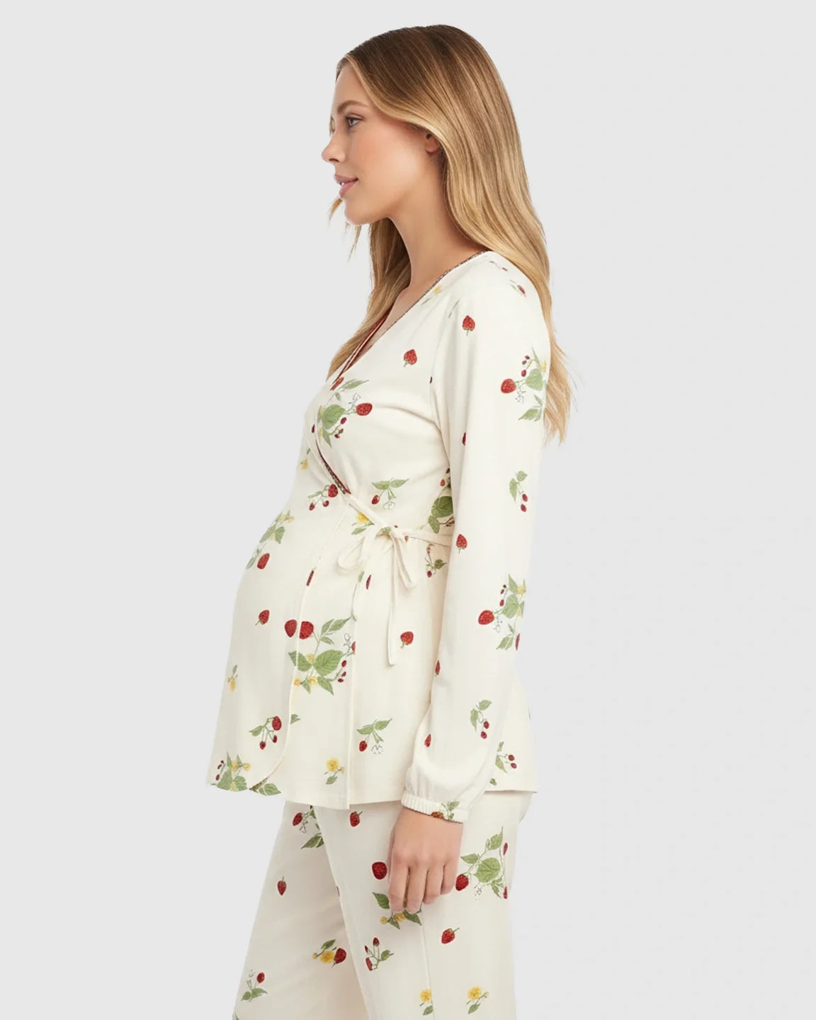 Pregnant woman in cream cotton floral wrap kimono maternity pajama set with strawberry print.