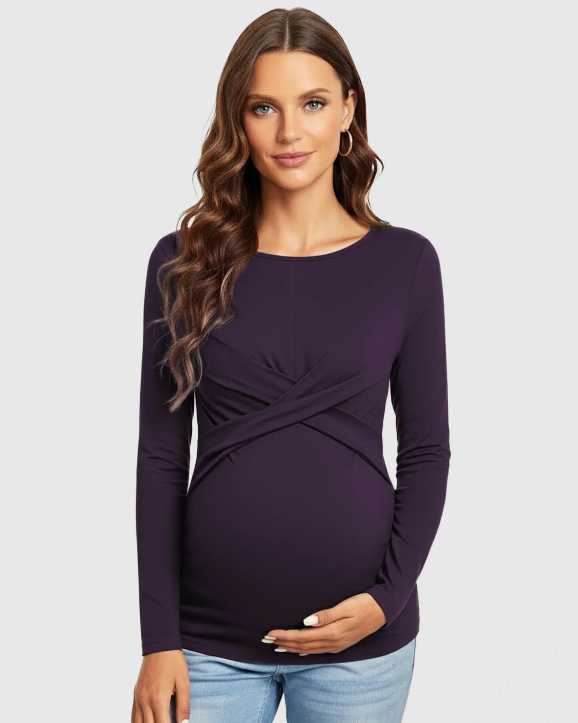 Maternity top in dark purple with cross-pleat twist-front detail, long sleeves, and round neckline.