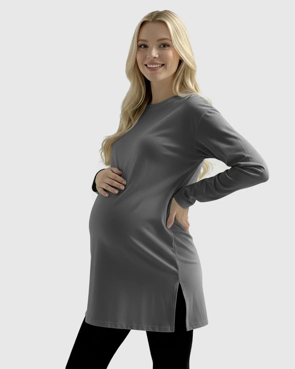 Smiling pregnant woman in a charcoal gray long-sleeve soft cotton maternity top with side slits.
