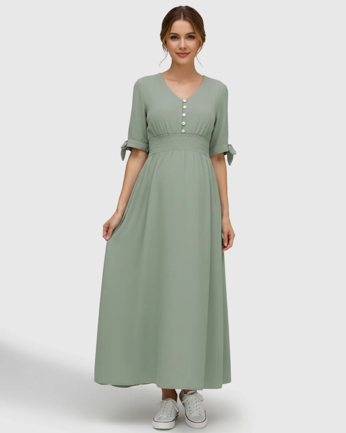 Mint green V-neck empire waist maternity maxi dress with button details and tied short sleeves.