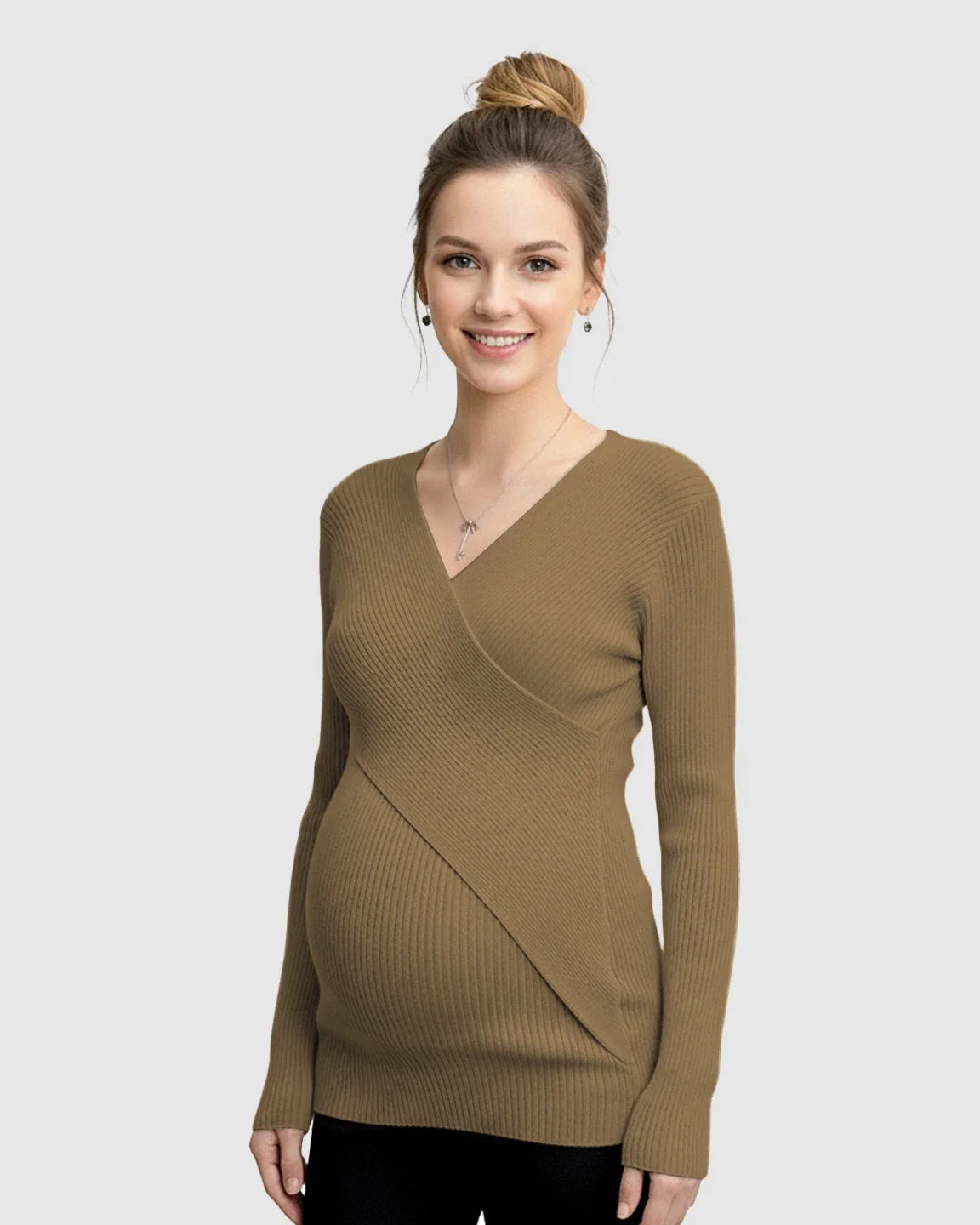 Smiling pregnant woman wearing a brown faux-wrap ribbed maternity top.