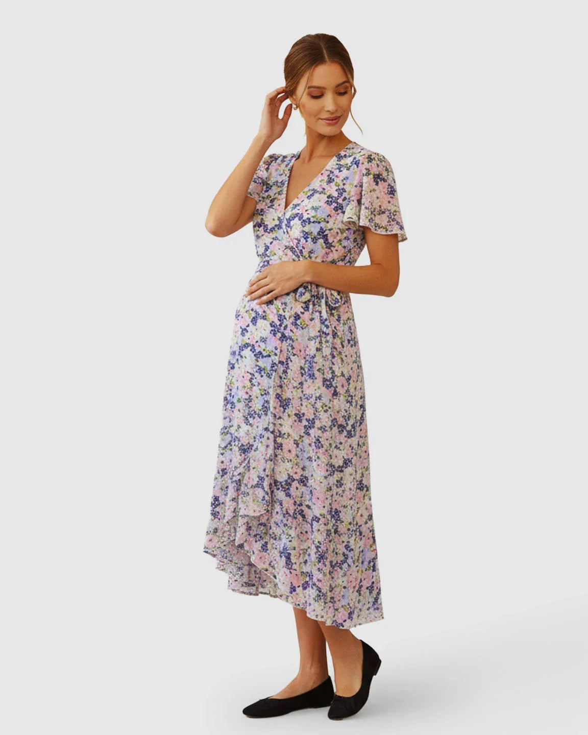 Maternity V-neck wrap-style midi dress with flutter sleeves and a breezy floral print.