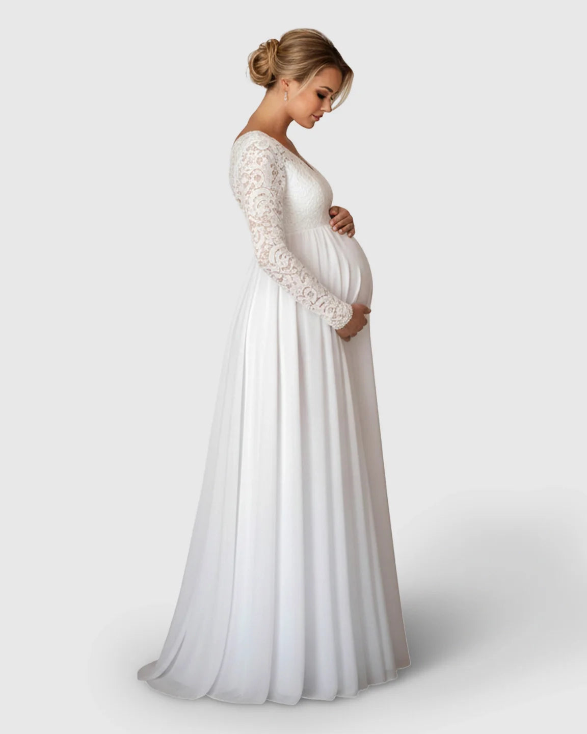White lace long-sleeve maternity bridal gown with V-neck and flowing skirt, worn by a pregnant woman.