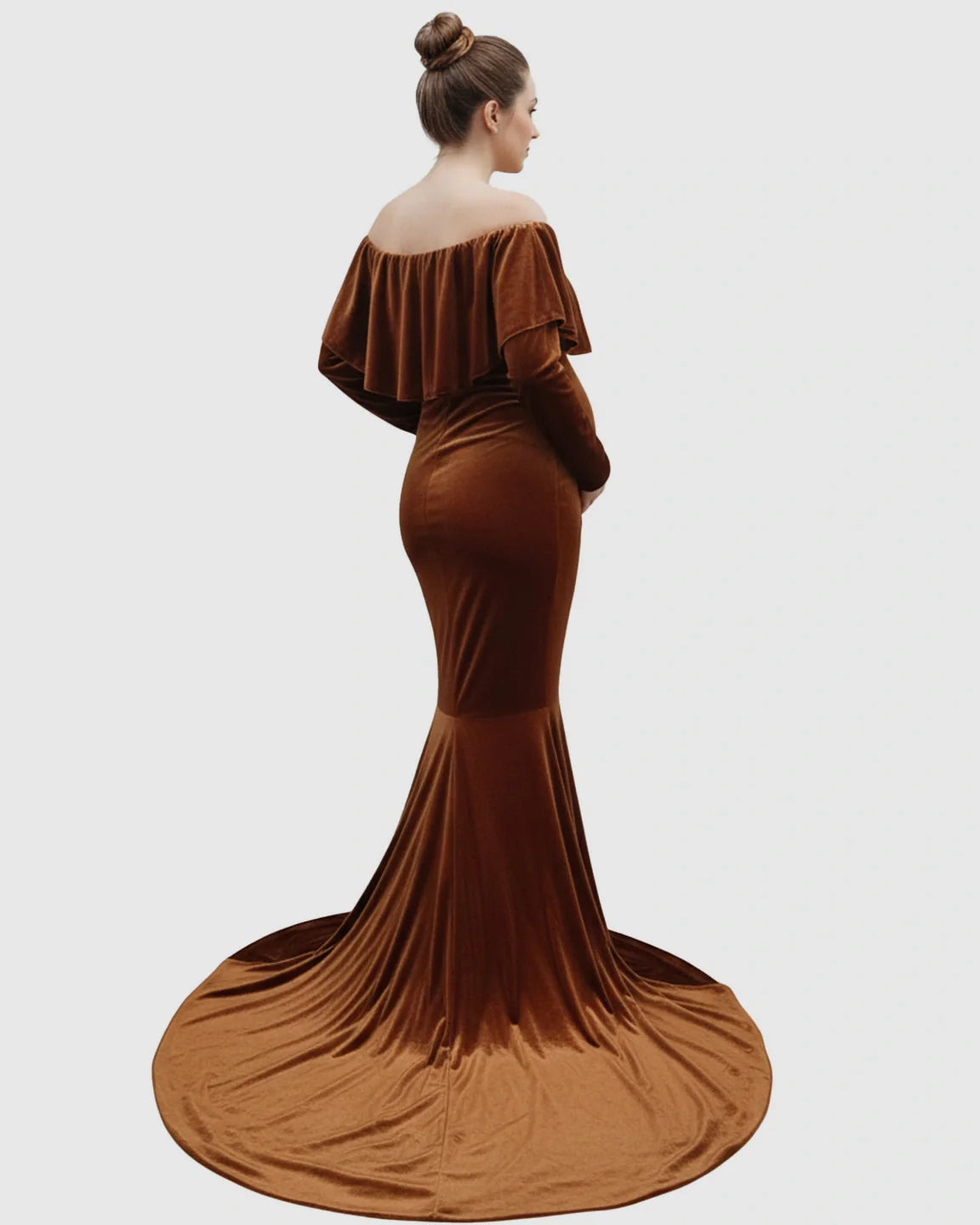 Maternity photoshoot gown: brown velvet, off-shoulder, fitted silhouette, long sleeves, and flowing train.