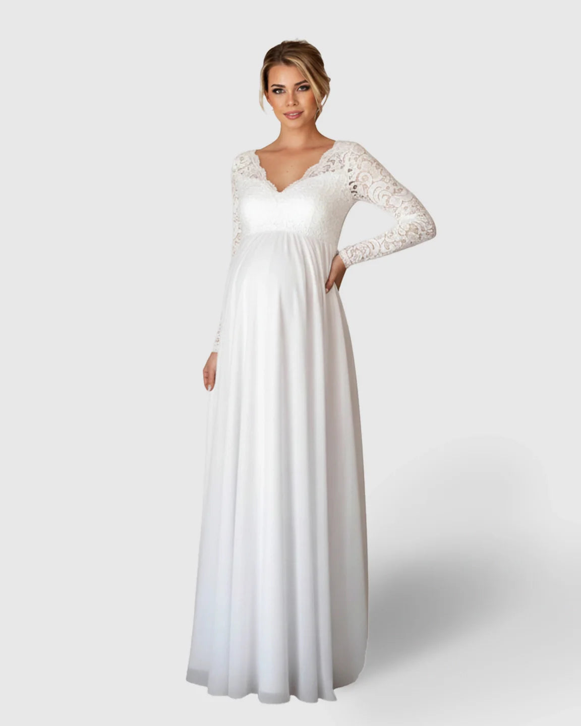 White lace maternity bridal gown with long sleeves, V-neck, Empire waist, and flowing skirt.