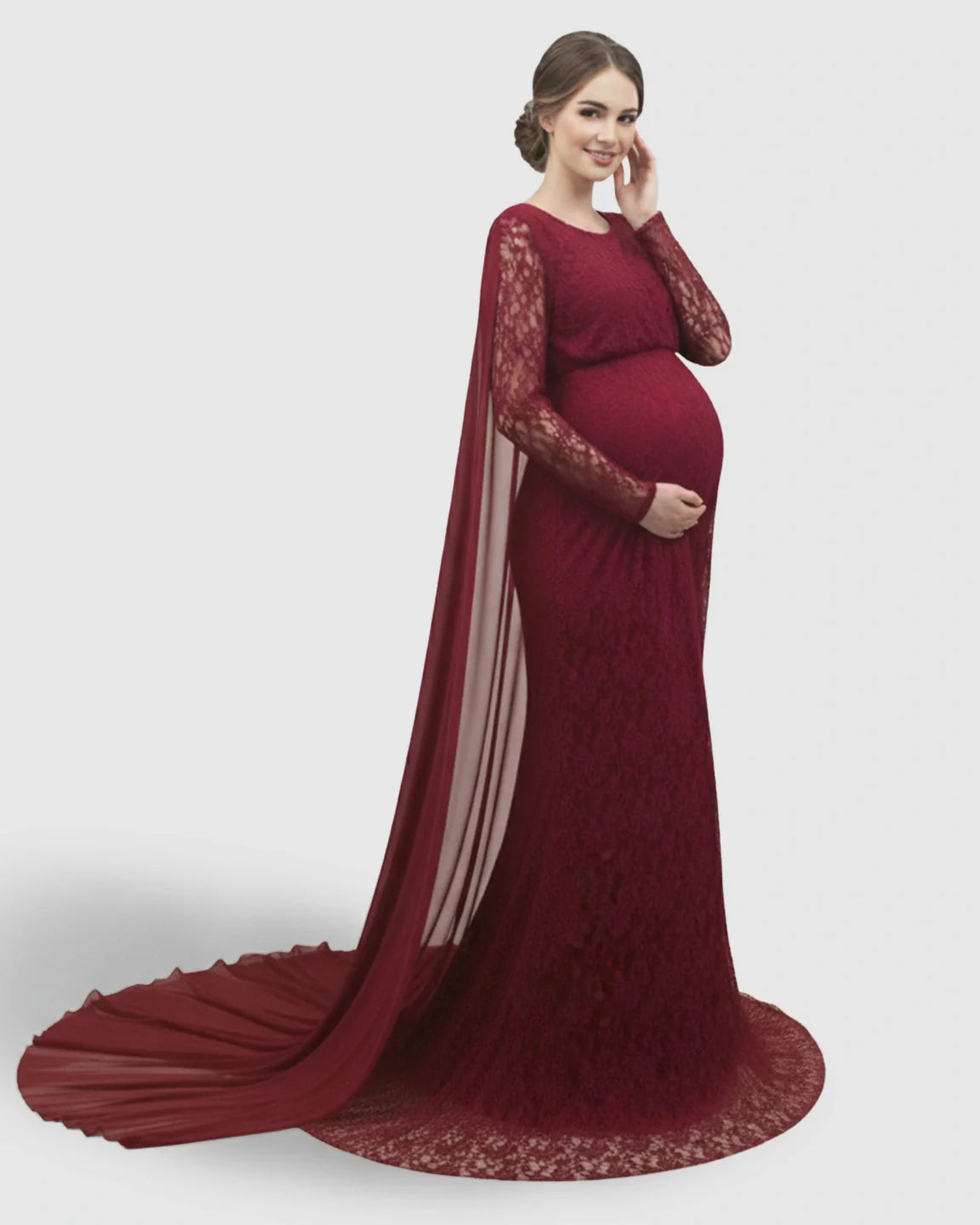 Red lace maternity gown with long sleeves, empire waist, and a trailing chiffon cape.