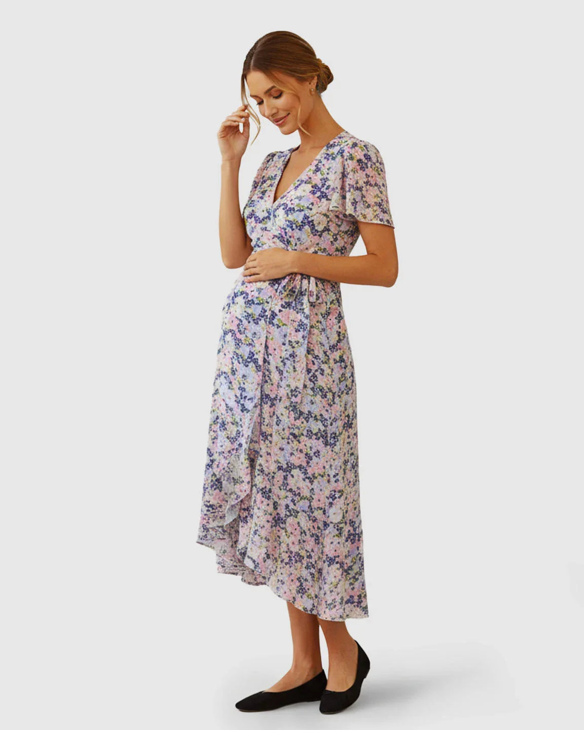 Floral V-neck wrap-style maternity midi dress with flutter sleeves and adjustable tie waist.