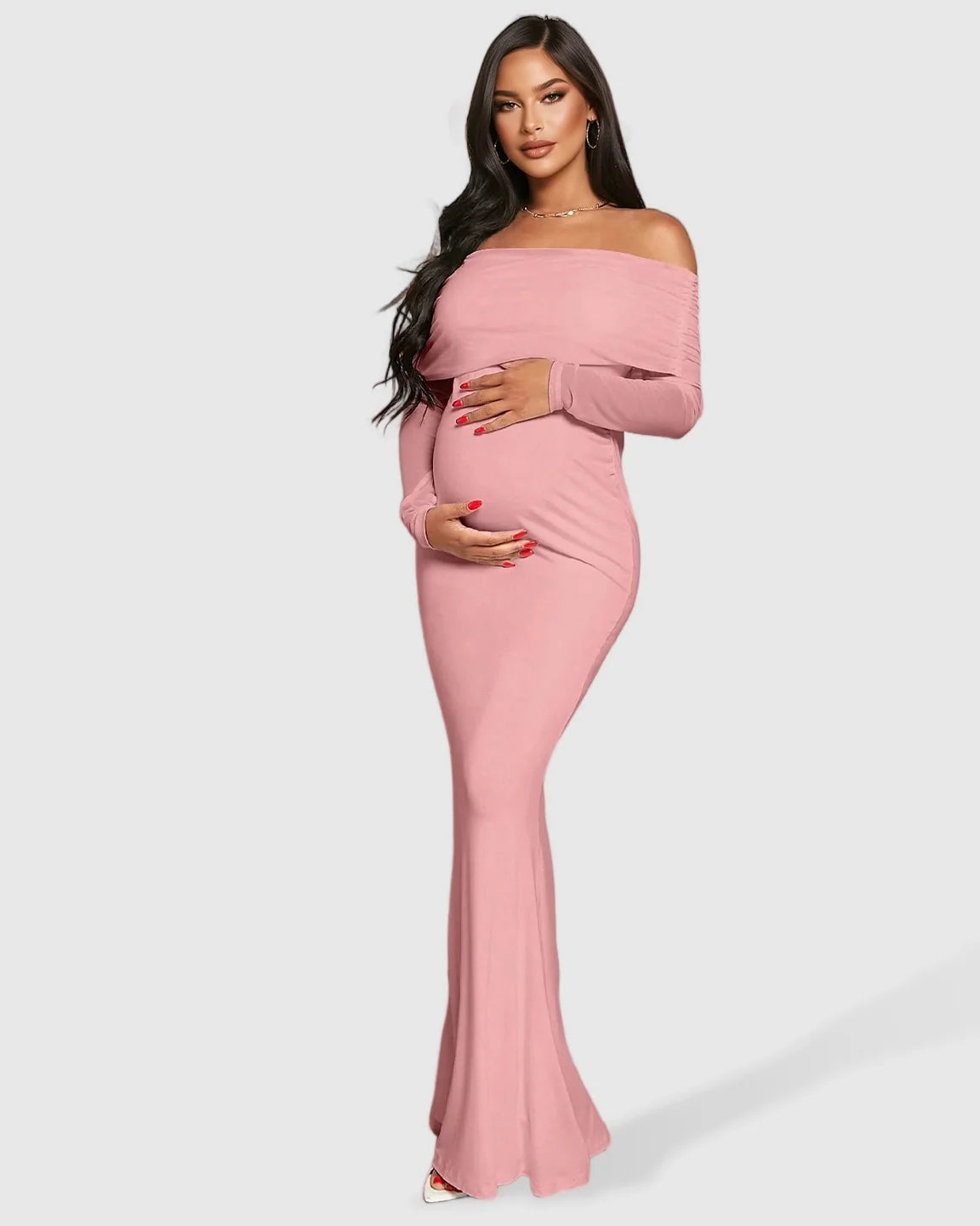 Pink draped neck mermaid fit maternity maxi dress with off-shoulder long sleeves, hugging a pregnant woman's bump.