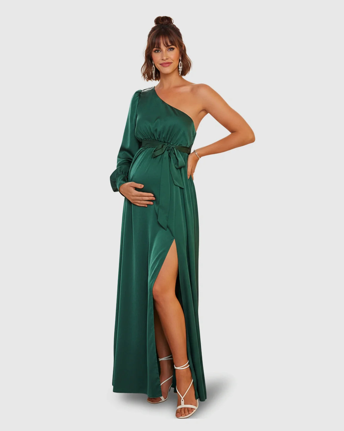 Elegant emerald green satin one-shoulder maternity maxi dress with a high slit, long sleeve, and tie-waist.