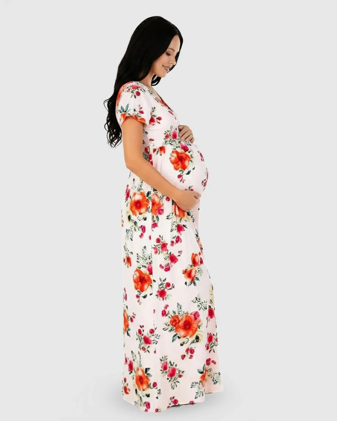 White floral V-neck short sleeve maternity maxi dress with red and orange flowers, worn by a pregnant woman.