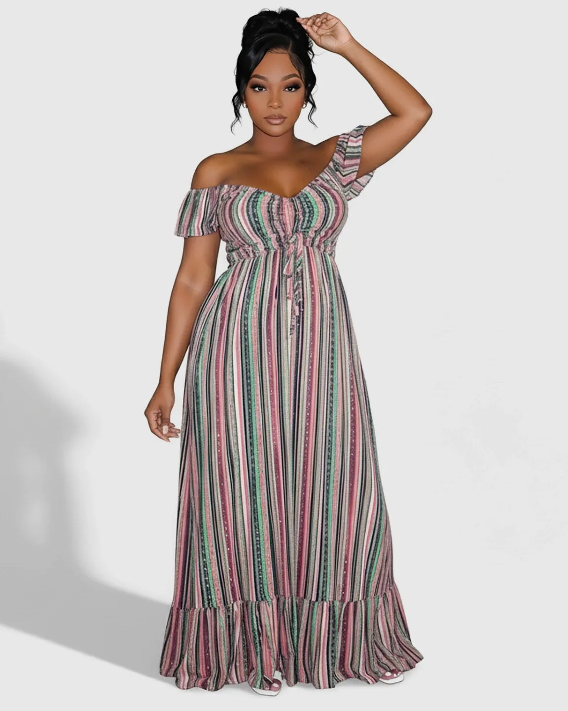Woman in a striped off-shoulder maternity maxi dress with a tie-up waist and ruffled hem.