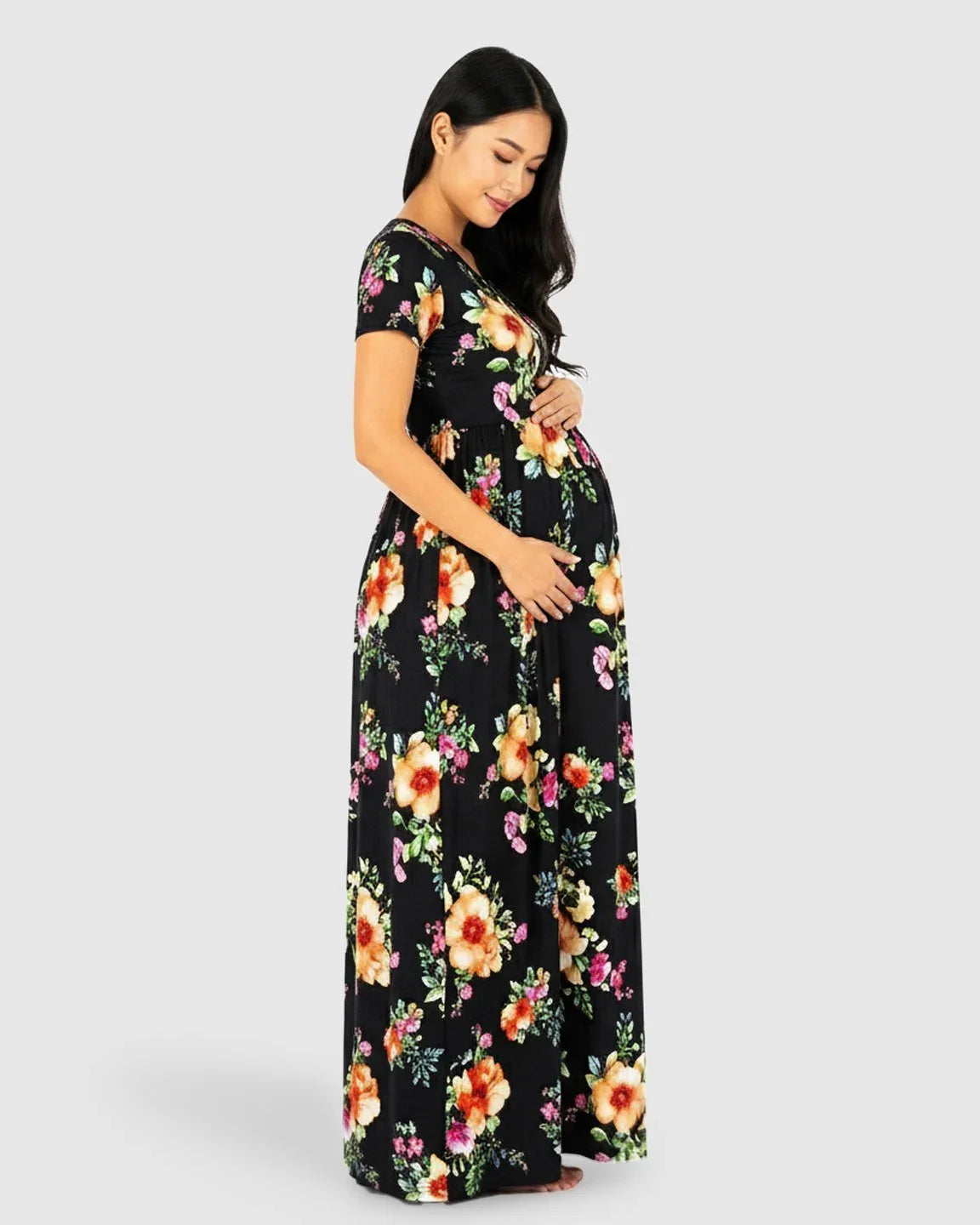 Black floral V-neck short sleeve maternity maxi dress with a relaxed fit, made from a soft cotton-blend fabric.