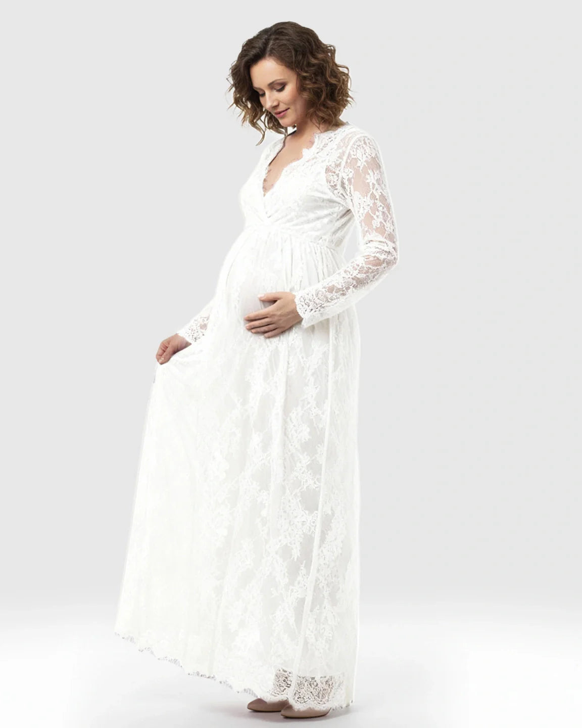 White sheer floral lace empire waist maternity maxi dress with long sleeves.