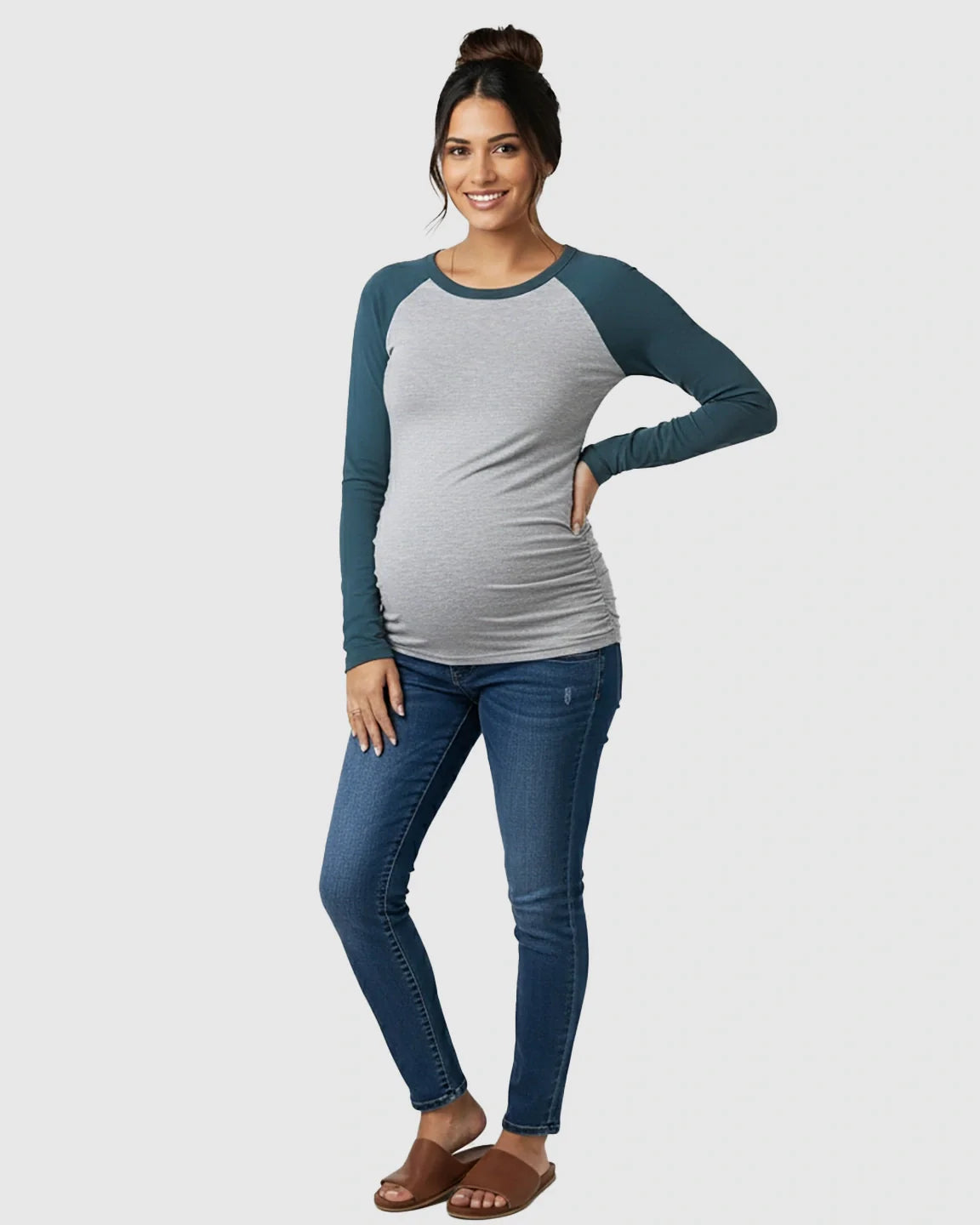 Maternity top: gray body, teal raglan sleeves, ruched sides, paired with jeans.