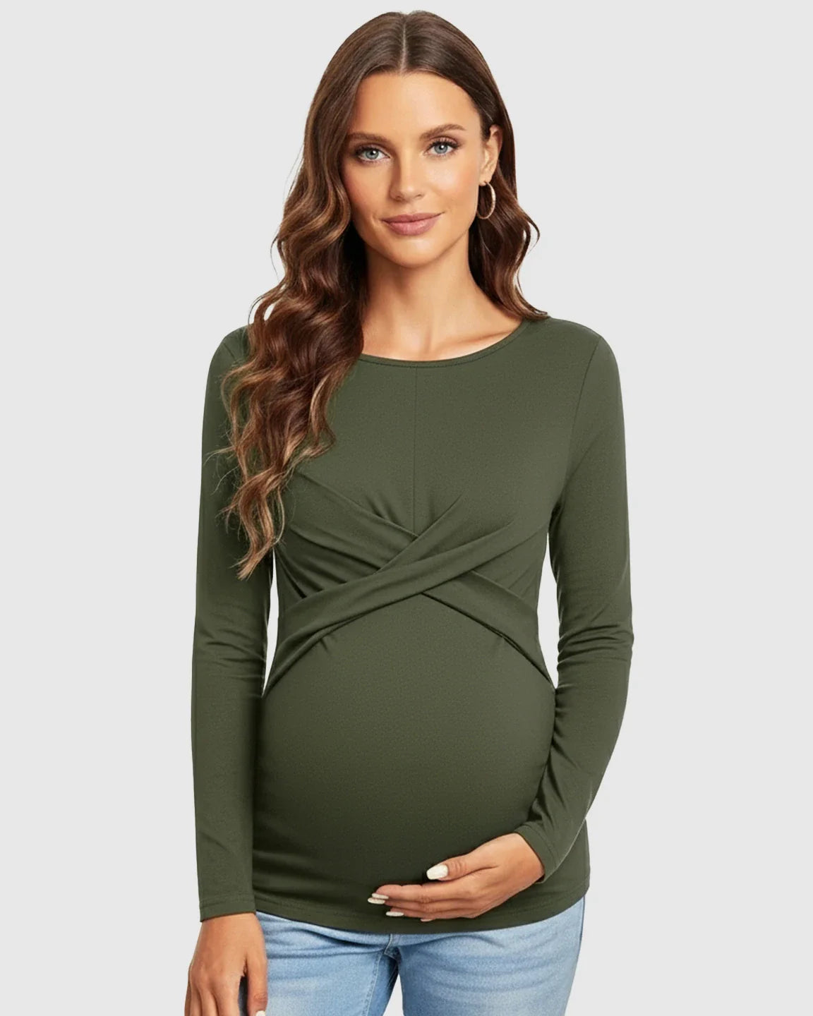 Maternity top in olive green with cross-pleat front, long sleeves, and round neckline, worn by a pregnant woman.