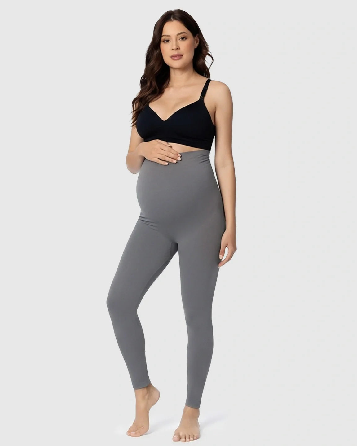 Pregnant woman in gray Bump Society Belly Support Stretch Maternity Leggings and black bra.