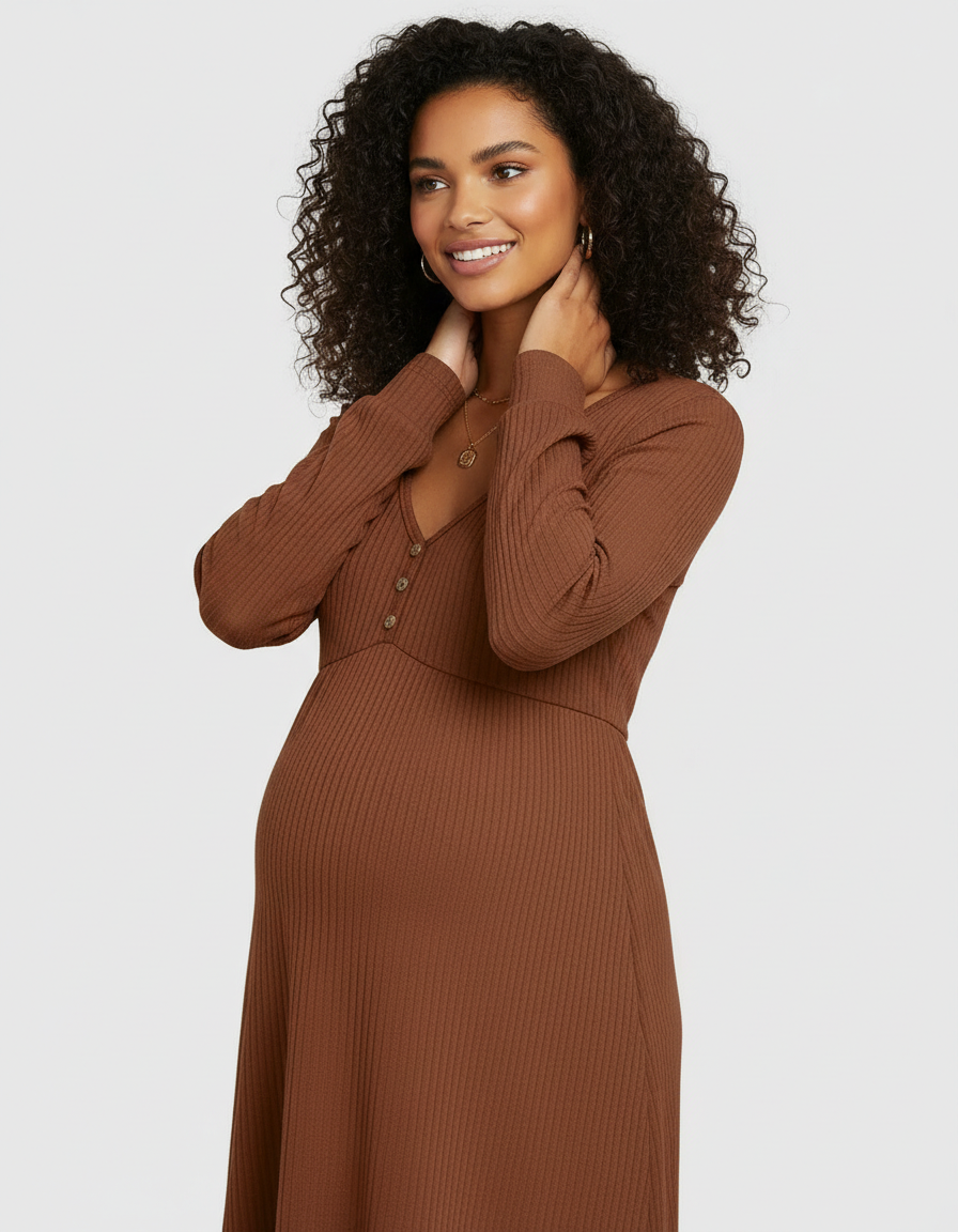 Smiling pregnant woman in a brown ribbed long-sleeve maternity dress with a V-neck and button detail.